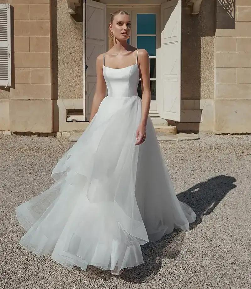 Model wearing a white gown by Sincerity