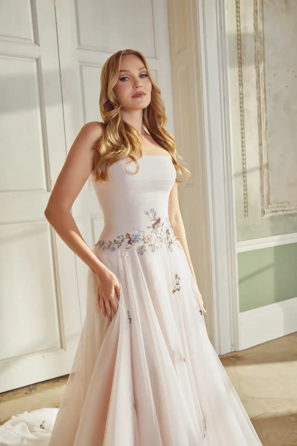 Model wearing a white gown by Sincerity