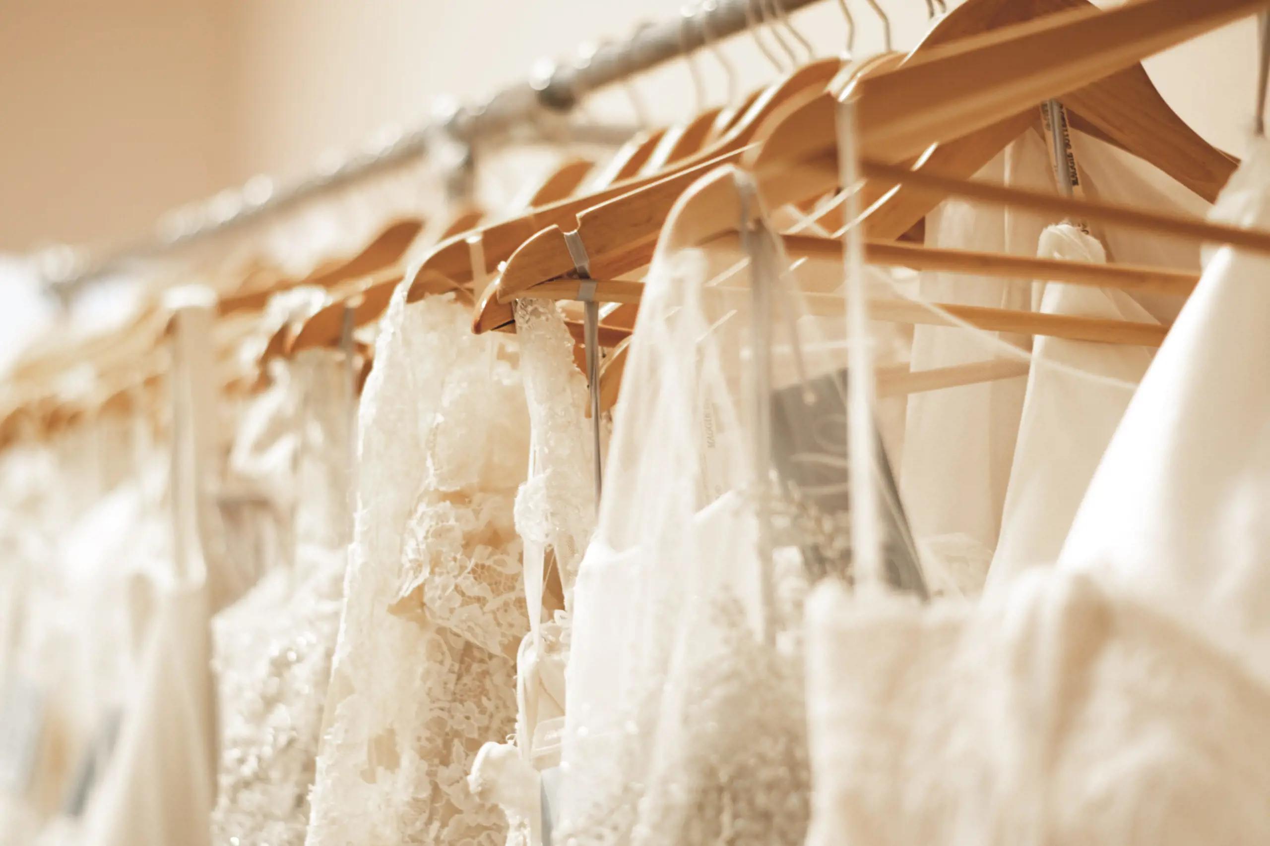 Photo of the dresses on hangers - Mobile Image