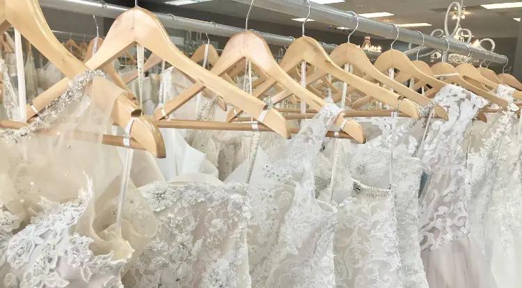 Photo of the bridal gowns on the hangers - Mobile Image